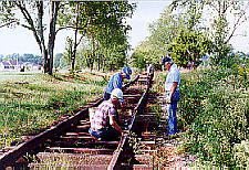 PEOPLE WORKING ON THE TRACKS